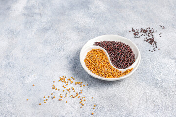 Organic mustard seeds in a small bowl.