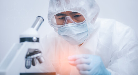 biochemical research scientist working with microscope for coronavirus, laboratory glassware containing chemical liquid for design or decorate science, chemistry, biology, medicine and people concept