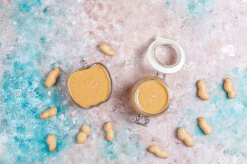 Homemade peanut butter in a jar and bowl.