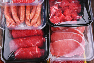 Composition with packages of assorted meat products
