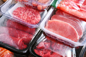 Composition with packages of assorted meat products