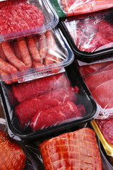 Composition with packages of assorted meat products
