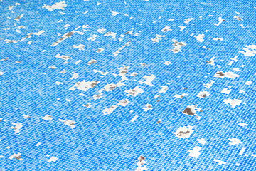 Broken tile in the swimming pool background