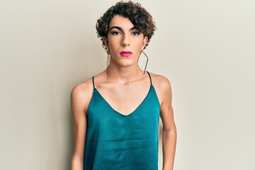 Young transgender man wearing make up and woman clothes, looking fashion and glamorous