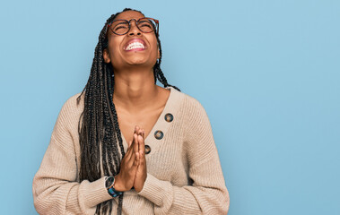 African american woman wearing casual clothes begging and praying with hands together with hope...