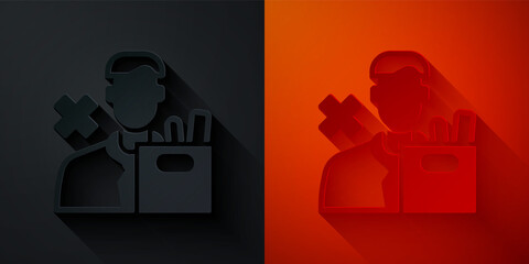 Paper cut Dismissed sad young man carrying box with his personal belonging leaving his job icon isolated on black and red background. Employee fired from work. Paper art style. Vector