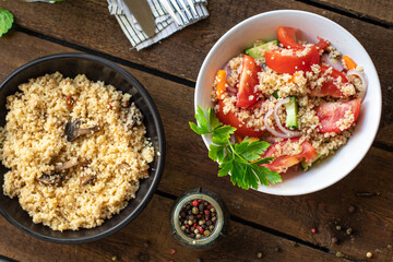 couscous salad tomato, cucumber, spices vegetable appetizer fresh portion organic on the table healthy meal snack copy space food background rustic top view 