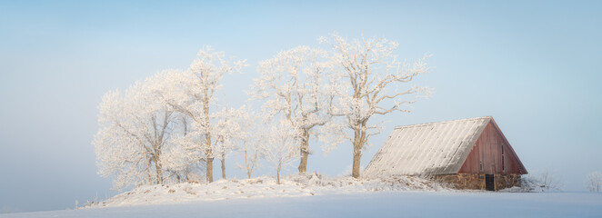 Barn in cold winter landscape - 437703585