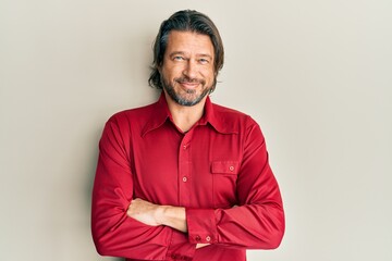 Obraz premium Middle age handsome man wearing casual clothes happy face smiling with crossed arms looking at the camera. positive person.