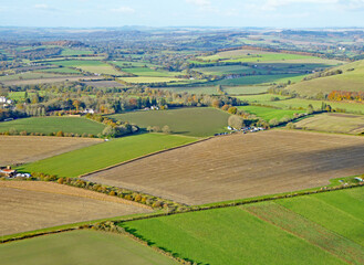 Fototapeta na wymiar Paragliding above the fields at Monks Down in Wiltshire 