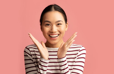 Surprised Young Korean Lady Raising Hands And Looking At Camera With Excitement