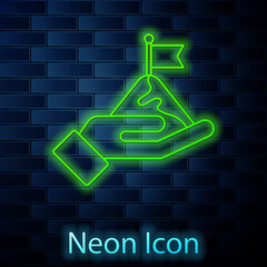 Glowing neon line Mountains with flag on top icon isolated on brick wall background. Symbol of victory or success concept. Goal achievement. Vector