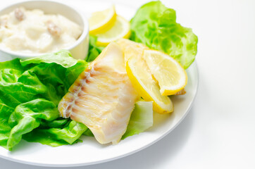 Steamed haddock fillet served with an exquisite salad consisting of cabbage, celery and apple with sultanas and roasted peanuts in mayonnaise