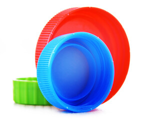 Colorful plastic bottle caps isolated on white. Recycling