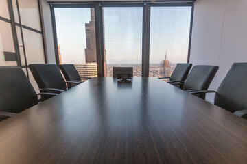 Empty boardroom with view of large skyscraper in downtown Chicago during the day - 437713107