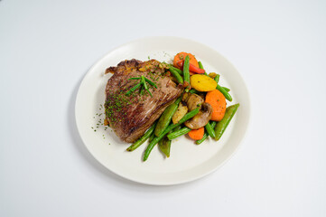 grilled beef steak and vegetables