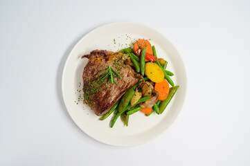 grilled beef steak and vegetables