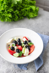 fresh greek salad vegetable, olives, tomato, cucumber, olive oil traditional recipe organic dish on the table healthy food meal snack copy space food background rustic. top view keto or paleo diet