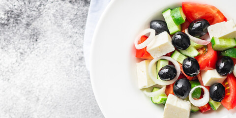 fresh greek salad vegetable, olives, tomato, cucumber, olive oil traditional recipe organic dish on the table healthy food meal snack copy space food background rustic. top view keto or paleo diet