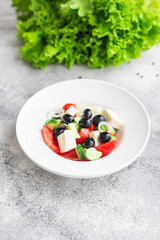 fresh greek salad vegetable, olives, tomato, cucumber, olive oil traditional recipe organic dish on the table healthy food meal snack copy space food background rustic. top view keto or paleo diet