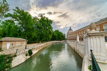 River Tagus as it passes through the royal palace of Aranjuez on a cloudy day at dawn.