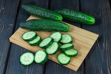 fresh sliced green cucumber on the board