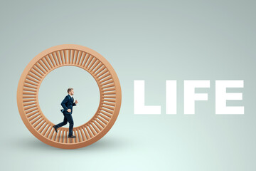 A man in a suit runs in a hamster wheel. The concept of liberation from slavery, life, business, manipulation, control.