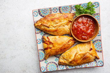 Asian food Samsa or samosas with chicken fillet on a plate. Top view