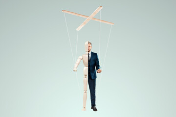 Male hand, puppeteer controls the puppet puppet with strings. The concept of shadow government,...