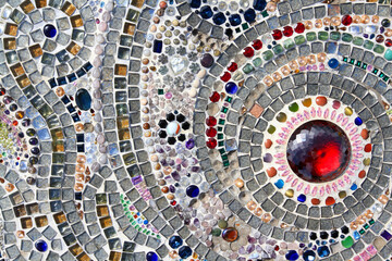 Many jewel or gem, colorful gravel and red diamond decorated on wall for background. Pattern of...