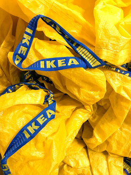 Cardiff, Wales - April 2018: Close up of the handles on heavy duty cusotmer shopping bags in a container inside a branch of IKEA
