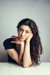 Portrait of a young emotional beautiful curly girl. Photography tests for an actress