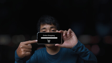 Young man holding smartphone with online shopping.shopping online concept.