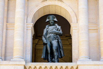 Fototapeta premium Low angle view of the statue of Napoleon Bonaparte on the balcony in the Hotel des Invalides in Paris, France