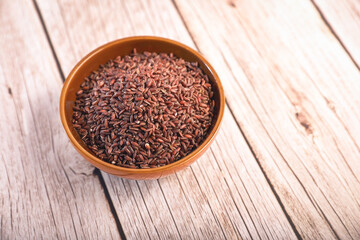 heap of red (brown) rice in a bowl	
