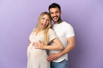 Young couple pregnant and doing surprise gesture