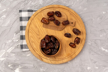 Dry date in a bowl. Ramadan Kareem with dates selective focus