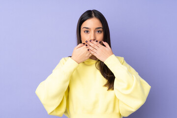 Young caucasian woman over isolated background covering mouth with hands