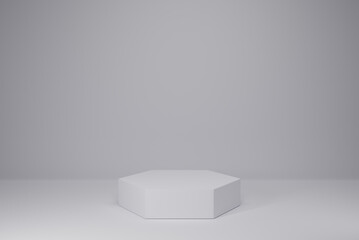 White hexagon pedestal empty on white background. 3D rendering podium for product demonstration.