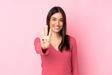 Young caucasian woman over isolated background happy and counting four with fingers