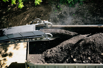 road milling machine cleans up old asphalt in yard