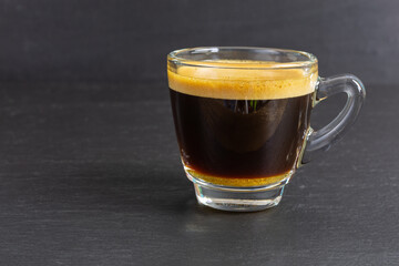 glass cup with fresh hot espresso