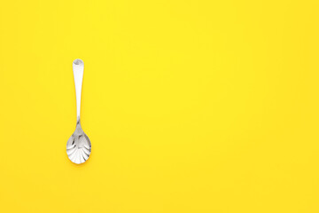 Clean spoon on color background