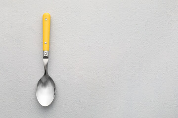 Clean spoon on light background