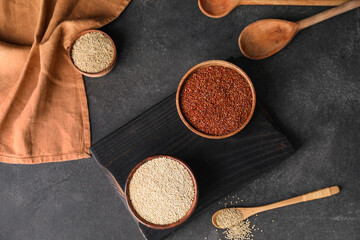 Fototapeta na wymiar Different healthy quinoa on dark background