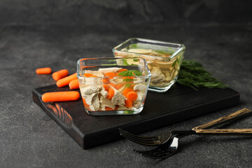 Bowls of tasty aspic on dark background