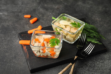 Bowls of tasty aspic on dark background