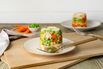 Plate with tasty aspic on table