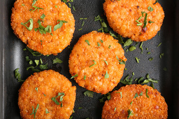 Frying pan with tasty lentil cutlets, top view