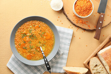 Bowl of tasty lentil soup on table